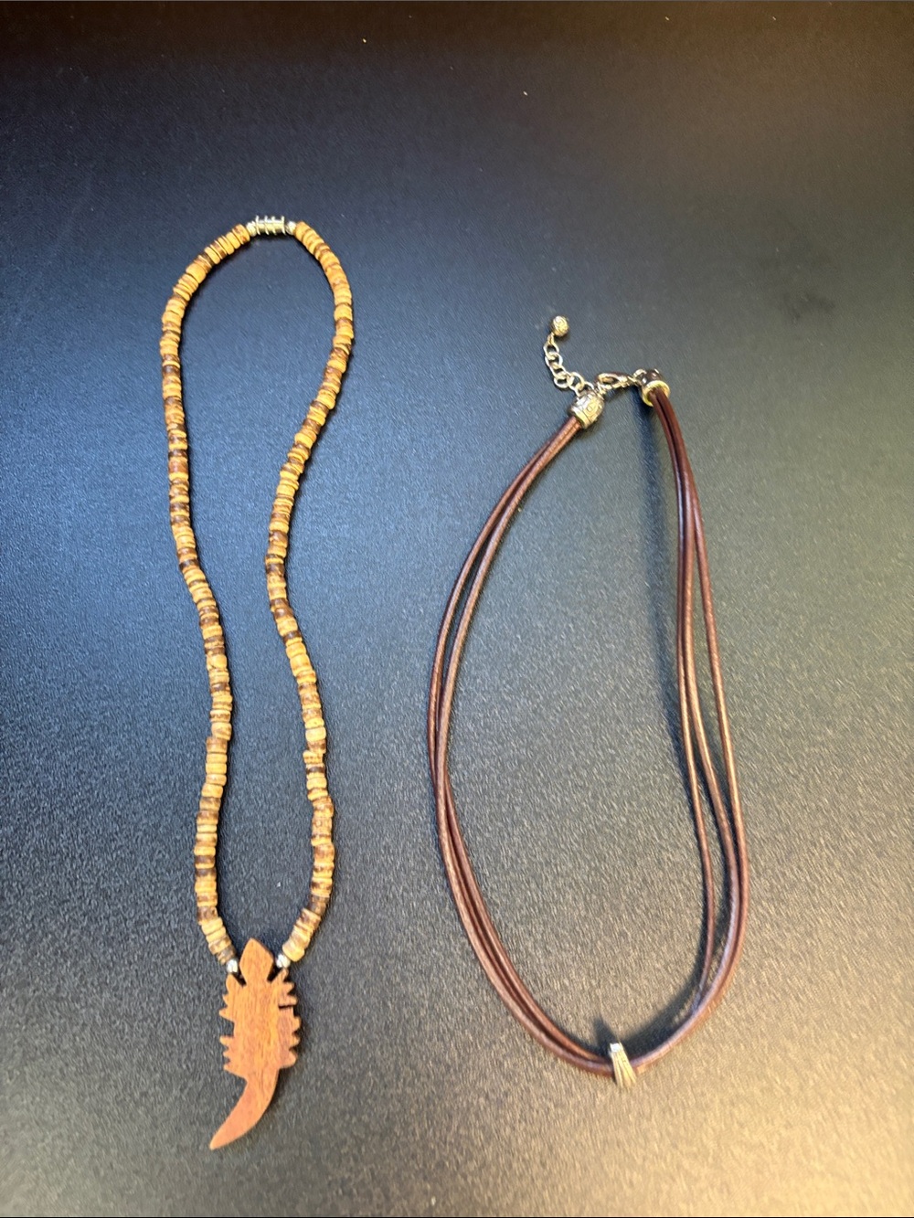 Brown Wood Bead Feather Pendant Necklace -and brown rope with silver small.
